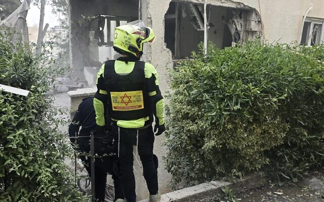 An Iranian missile attack causes damage in central Israel on March 18, 2026. (Magen David Adom)