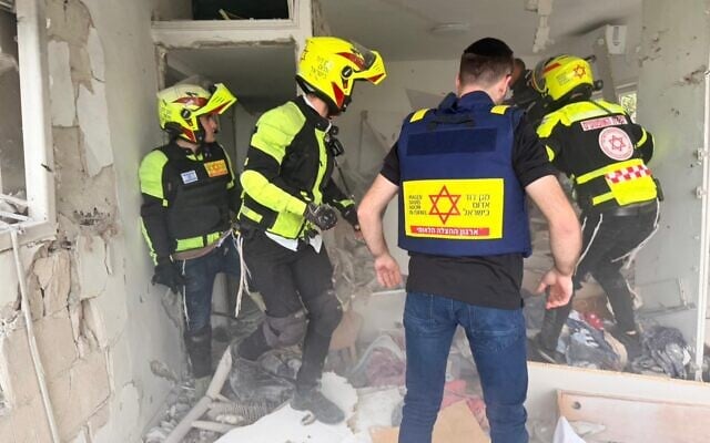 First responders at the site of a suspected Iranian cluster bomb impact in central Israel, March 18, 2026. (Magen David Adom)