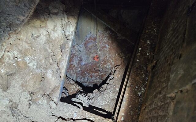 A tunnel is seen in the home of a Hamas member who is accused of planning a kidnapping attack, in the West Bank town of Beita, in a handout photo issued on March 25, 2026. (Israel Police)