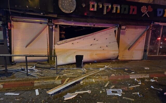 A photo from the Magen David Adom ambulance service shows a shop in central Israel, early March 28, 2026, after it was damaged by a bomblet from an Iranian ballistic missile carrying a cluster warhead. (Magen David Adom)