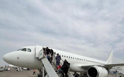 Israelis stranded in Dubai board a plane chartered by Israir to Aqaba airport in Jordan, March 6, 2026. (Courtesy Israir)