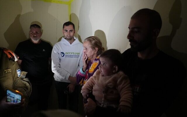 Minutes after the International Fellowship of Christians and Jews (IFCJ) installed a new reinforced shelter in Holon, residents rushed inside as sirens warned of incoming Iranian missiles, March 2, 2026. (Courtesy/Raanan Cohen/IFCJ)