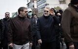 Ali Larijani (waving) participates in a Quds Day anti-Israel march in Tehran on March 13, 2026, the last time he was seen alive in public. (X, used in accordance with clause 27a of the copyright law)