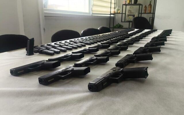 Handguns seized by police and army forces, after three men allegedly tried to smuggle the goods from Jordan into Israel, in a photo published on March 5, 2026. (Israel Police)