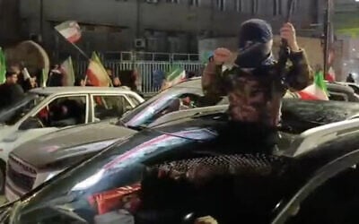 A screenshot of a video purporting to show an Iranian child recruit to the IRGC's Basij militia wearing a military uniform and carrying a rifle, seen in Shariati Square, Mashhad, Iran, March 30, 2026. (Telegram / used in accordance with Clause 27a of the Copyright Law)