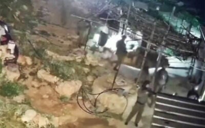 Settlers and soldiers seen entering the Palestinian village of Kharaba on April 9, 2026. (Screen capture/X, used in accordance with Clause 27a of the Copyright Law)