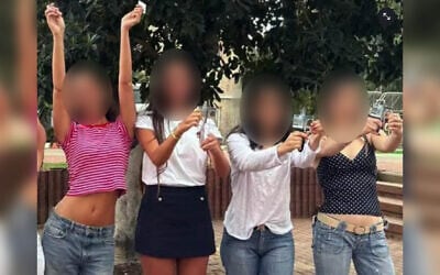 Female soldiers cut their military ID cards at an IDF base on the day of their discharge, when three of them were court-martialed and fined for wearing revealing clothing. (Screen capture: X, used in accordance with Clause 27a of the Copyright Law)