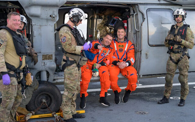 Astronauts on recovery ship