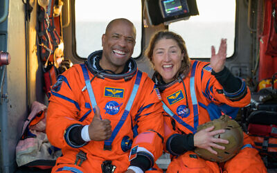 NASA astronaut Victor Glover, Artemis II pilot, left, and NASA astronaut Christina Koch, Artemis II mission specialist are seen sitting on a Navy MH-60 Seahawk on the flight deck of USS John P. Murtha after splashdown, April 10, 2026, in the Pacific Ocean off the coast of California (NASA/Bill Ingalls) NASA astronaut Victor Glover, Artemis II pilot, left, and NASA astronaut Christina Koch, Artemis II mission specialist are seen sitting on a Navy MH-60 Seahawk on the flight deck of USS John P. Murtha after splashdown, April 10, 2026, in the Pacific Ocean off the coast of California (NASA/Bill Ingalls)