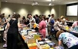 Ilustrative: Jewish book lovers gather at the Jewish Book Council's offices in Manhattan, July 19, 2023. (Gabe Friedman/JTA)