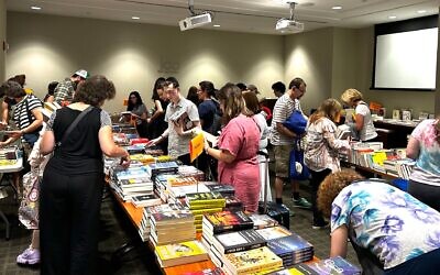 Ilustrative: Jewish book lovers gather at the Jewish Book Council's offices in Manhattan, July 19, 2023. (Gabe Friedman/JTA)
