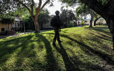 An Israeli soldier walks outside a home attacked by Palestinian terrorists on October 7, in Kibbutz Holit on October 26, 2023. (YURI CORTEZ / AFP) An Israeli soldier walks outside a home attacked by Palestinian terrorists on October 7, in Kibbutz Holit on October 26, 2023. (YURI CORTEZ / AFP)