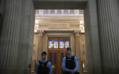 Illustrative: French gendarmes stand guard in front of a courtroom at the Paris Appeal Court in the Palais de Justice courthouse in Paris on March 16, 2026. (Julien De Rosa/AFP)