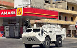A vehicle of the United Nations Interim Force in Lebanon (UNIFIL) moves along a street in Lebanon's southern coastal city of Tyre on March 18, 2026. (Kawnat HAJU / AFP)