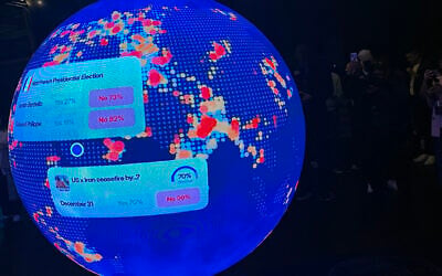 A LED sphere screen shows information inside the new location of the prediction market online platform Polymarket called 'The Situation Room,' during its opening day in Washington, DC, March 20, 2026. (Théo Marie-Courtois/AFP)