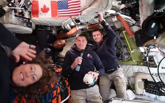 This screengrab from a NASA live broadcast video shows (L-R) NASA astronaut and Artemis II Mission Specialist Christina Koch, NASA astronaut and Artemis II pilot Victor Glover, Canadian Space Agency astronaut Artemis II Mission Specialist Jeremy Hansen and NASA astronaut and Artemis II Commander Reid Wiseman during a press call as they travel to the Moon in the Orion spacecraft, on April 3, 2026 (NASA / AFP) This screengrab from a NASA live broadcast video shows (L-R) NASA astronaut and Artemis II Mission Specialist Christina Koch, NASA astronaut and Artemis II pilot Victor Glover, Canadian Space Agency astronaut Artemis II Mission Specialist Jeremy Hansen and NASA astronaut and Artemis II Commander Reid Wiseman during a press call as they travel to the Moon in the Orion spacecraft, on April 3, 2026 (NASA / AFP)