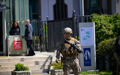 A member of Turkish security forces stands alert near the unstaffed Israeli Consulate in Istanbul on April 7, 2026, following a shootout between gunmen and police. (Yasin AKGUL / AFP)