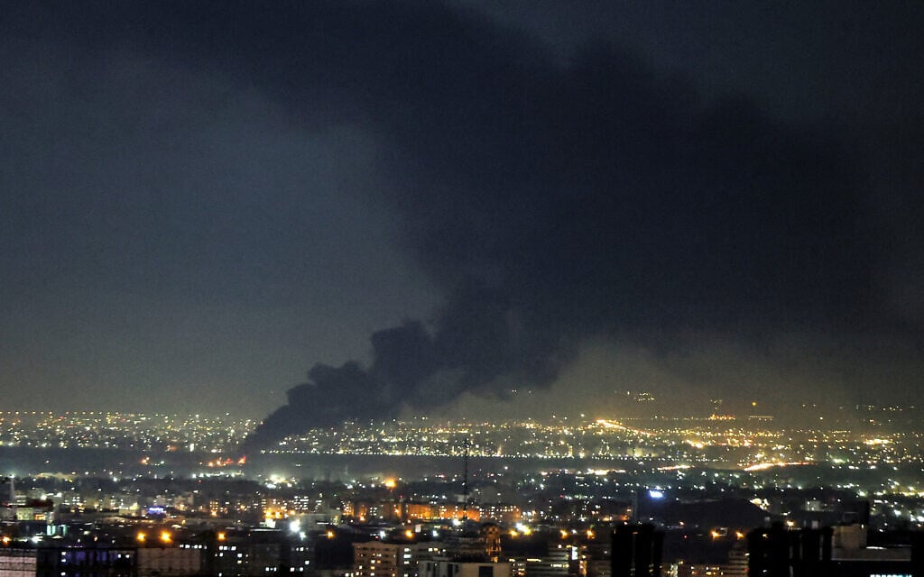 Smoke rises from the site of a strike on the Iranian capital Tehran on April 7, 2026 (ATTA KENARE / AFP) /