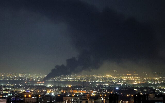 Smoke rises from the site of a strike on the Iranian capital Tehran on April 7, 2026 (ATTA KENARE / AFP) /