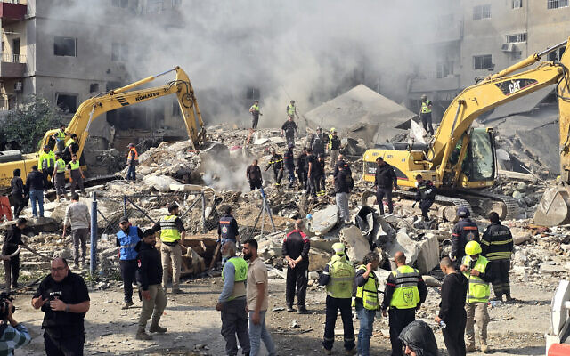 First responders rush to the site of an Israeli airstrike that targeted a building in southern Lebanese coastal city of Tyre on April 8, 2026. (KAWNAT HAJU / AFP) First responders rush to the site of an Israeli airstrike that targeted a building in southern Lebanese coastal city of Tyre on April 8, 2026. (KAWNAT HAJU / AFP)
