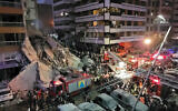 First responders and residents gather at the site of an Israeli airstrike in Beirut's Tallet al-Khayyat neighborhood, on April 8, 2026. (Fadel ITANI / AFP) /