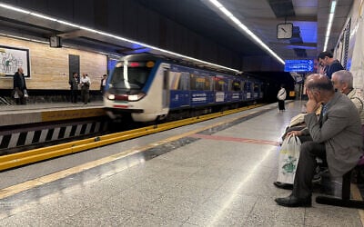 Commuters wait on the platform for their metro train to arrive in Tehran, Iran on April 13, 2026 (ATTA KENARE / AFP)