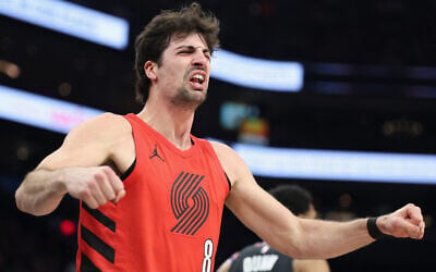 Deni Avdija of the Portland Trail Blazers reacts after scoring and drawing a foul against the Phoenix Suns during the first half of an NBA play-in tournament game at Mortgage Matchup Center on April 14, 2026, in Phoenix, Arizona. (Christian Petersen/Getty Images/AFP)