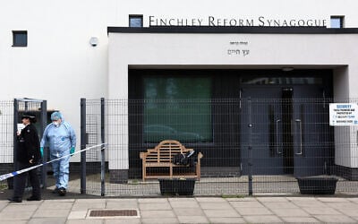 A police forensics officer works during an investigation into an attack in the early hours of the morning, at the Finchley Reform Synagogue, in the North Finchley area of north London, on April 15, 2026. (Toby Shepheard / AFP)