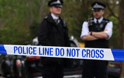 Police officers stand on duty at a cordon near the Finchley Reform Synagogue, in the North Finchley area of north London, on April 15, 2026, following an attack on the synagogue in the early hours of the morning. (Toby Shepheard / AFP)