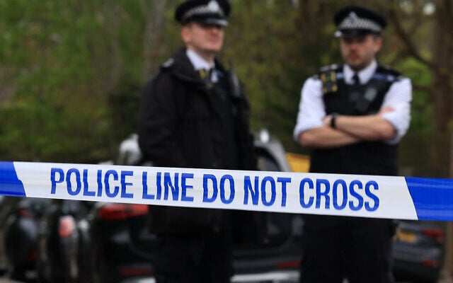 Police officers stand on duty at a cordon near to the Finchley Reform Synagogue, in the North Finchley area of north London, on April 15, 2026, following an attack on the synagogue in the early hours of the morning. (Toby Shepheard / AFP)