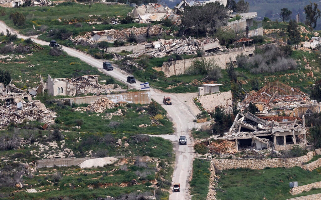 This photograph taken from the northern Israel shows Israeli military vehicles driving along the road in the southern Lebanon near the border with Israel, on April 17, 2026. (Photo by Jalaa MAREY / AFP) This photograph taken from the northern Israel shows Israeli military vehicles driving along the road in the southern Lebanon near the border with Israel, on April 17, 2026. (Photo by Jalaa MAREY / AFP)