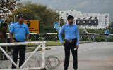 Security personnel stand guard at a checkpoint near the Serena Hotel, which hosted the first round of US-Iran negotiations during the Middle East war, at the Red Zone area in Islamabad on April 21, 2026, amid heightened security measures ahead of the anticipated second round of US-Iran peace talks. (Asif HASSAN / AFP)