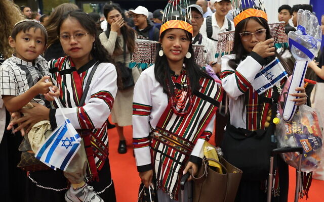 Members of the Bnei Menashe (Sons of Manasseh) community in India pose as they arrive at Ben Gurion Airport on April 23, 2026. (Jack Guez/AFP) Members of the Bnei Menashe (Sons of Manasseh) community in India pose as they arrive at Ben Gurion Airport on April 23, 2026. (Jack Guez/AFP)