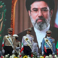 Iranian army soldiers stand in front of a picture of Iran's Supreme Leader Ayatollah Mojtaba Khamenei during a pro-regime rally in Tehran, Iran, on April 29, 2026. (AFP)