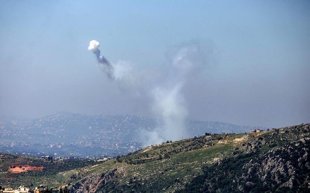 A photograph taken from the southern Lebanese area of Marjeyoun shows the smoke traces of Israeli shelling as it targets the village of Yohmor on April 30, 2026. (AFP)