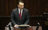 Poland's Foreign Minister Radek Sikorski gives a speech at the parliament, in Warsaw, Poland, April 23, 2025. (Czarek Sokolowski/AP)