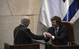 Israel's Prime Minister Benjamin Netanyahu, left, greets Argentina's President Javier Milei in the Knesset, Israel's parliament, in Jerusalem, June 11, 2025. (AP Photo/Ohad Zwigenberg)