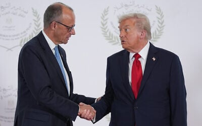 US President Donald Trump, right, greets Germany's Chancellor Friedrich Merz during summit to support ending the Israel-Hamas war in Gaza, October 13, 2025, in Sharm El Sheikh, Egypt. (AP Photo/Evan Vucci, Pool) US President Donald Trump, right, greets Germany's Chancellor Friedrich Merz during summit to support ending the Israel-Hamas war in Gaza, October 13, 2025, in Sharm El Sheikh, Egypt. (AP Photo/Evan Vucci, Pool)