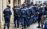 Illustrative: German police officers walk in Munich, Germany, Thursday, Feb. 12, 2026. (AP Photo/Michael Probst)