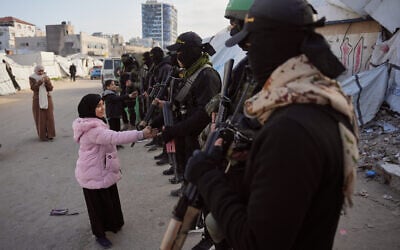 Armed members of Hamas and Islamic Jihad greet people gathering for Eid al-Fitr prayers in Gaza City, Friday, March 20, 2026. (AP/Abdel Kareem Hana)