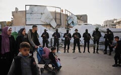 Palestinian gunmen from Hamas and Islamic Jihad gather next to Eid al-Fitr prayers in Gaza City, Friday, March 20, 2026. (AP/Abdel Kareem Hana)