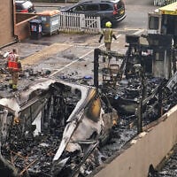 The wreckage of burnt ambulances is seen in a car park at Golders Green in London, March 23, 2026, after an arson attack targeting the vehicles, which were run by a Jewish charity. (AP Photo/Alberto Pezzali)