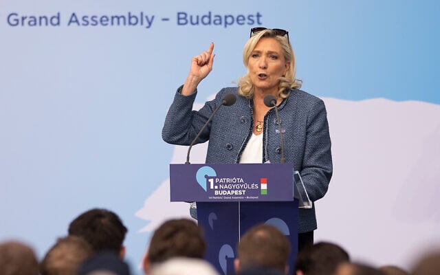 France's Marine Le Pen speaks at an assembly of European far-right parties in Budapest, Hungary, March 23, 2026. (Denes Erdos/AP) France's Marine Le Pen speaks at an assembly of European far-right parties in Budapest, Hungary, March 23, 2026. (Denes Erdos/AP)