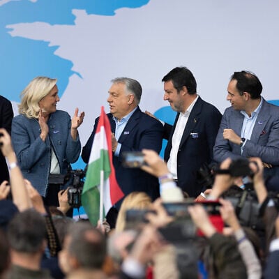 Hungarian Prime Minister Viktor Orbán, third from left, stands with, from left; Geert Wilders of the Netherlands, France's Marine Le Pen, Italy's Matteo Salvini, Belgium's Tom Van Grieken and Latvia's Ainārs Šlesers during an assembly of European far-right parties with Orbán’s Patriots for Europe group, in Budapest, Hungary, on March 23, 2026. (AP Photo/Denes Erdos)