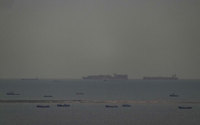 Fishing boats dot the sea as cargo ships, in the background, sail through the Arabian Gulf toward the Strait of Hormuz off the United Arab Emirates, Friday, March 27, 2026. (AP Photo) Fishing boats dot the sea as cargo ships, in the background, sail through the Arabian Gulf toward the Strait of Hormuz off the United Arab Emirates, Friday, March 27, 2026. (AP Photo)