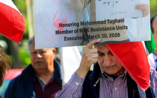 Glenn Torshizi, whose brothers were executed by the Iranian government, joins others in a picket line at the US State Department to highlight the executions in Karaj, Iran, of People's Mojahedin Organization of Iran members, March 30, 2026, in Washington. (AP Photo/ Rod Lamkey, Jr.)