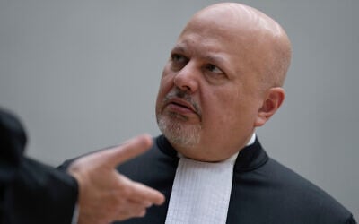 ICC Chief Prosecutor Karim Khan talks before convening the International Criminal Court in The Hague, Netherlands, March 14, 2025. (AP Photo/Peter Dejong, Pool)