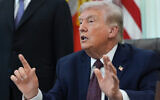 US President Donald Trump answers questions from reporters after signing an executive order in the Oval Office of the White House in Washington, DC, March 31, 2026. (AP/Alex Brandon)