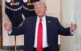 US President Donald Trump gestures after speaking about the Iran war from the Cross Hall of the White House in Washington, April 1, 2026. (AP Photo/ Alex Brandon, Pool)