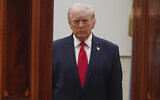 US President Donald Trump arrives from the Blue Room to speak about the Iran war from the Cross Hall of the White House, in Washington, April 1, 2026. (Alex Brandon/AP)